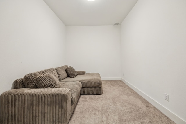 living room featuring light carpet