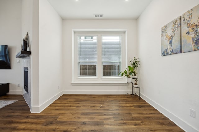 hallway with dark hardwood / wood-style floors