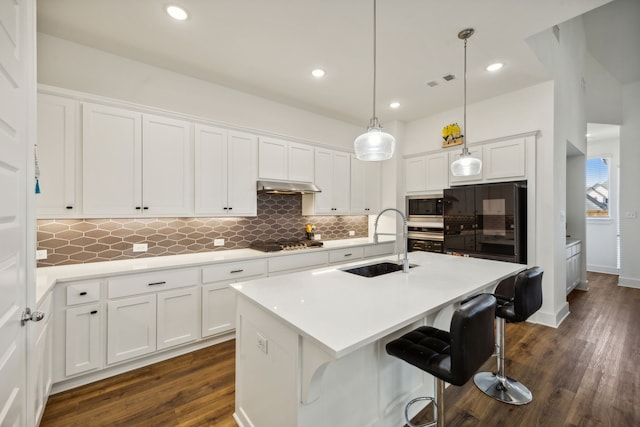 4707 Pin Oak Ct, Aubrey, TX 76227 - kitchen with white cabinets, stainless steel appliances, decorative backsplash, and a sink