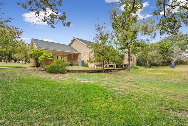 view of yard featuring central AC