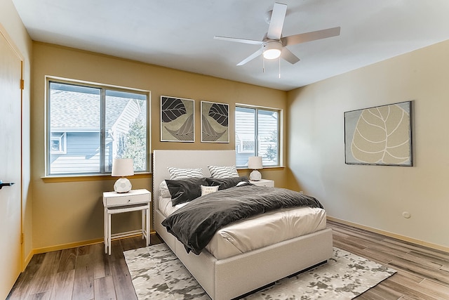 bedroom featuring hardwood / wood-style flooring and ceiling fan