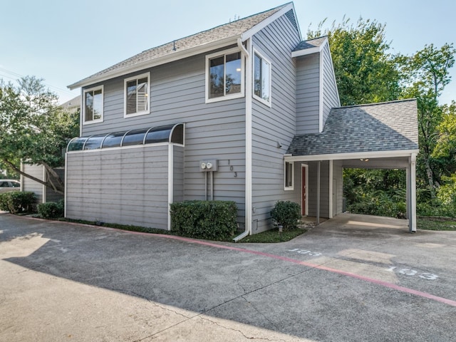 view of front of property with a carport