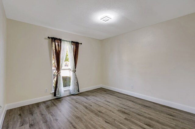 empty room with light wood-type flooring