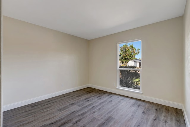 spare room with light hardwood / wood-style floors