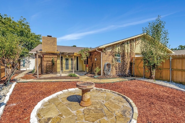 rear view of house with a patio