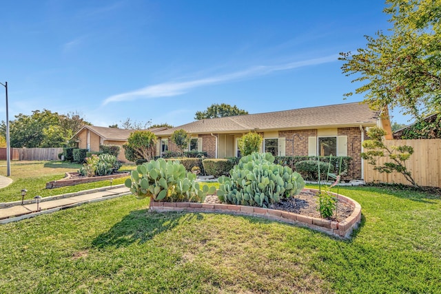 ranch-style home with a front lawn