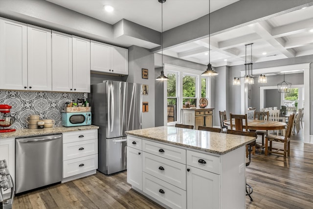 kitchen with white cabinetry, beam ceiling, stainless steel appliances, and dark wood-type flooring