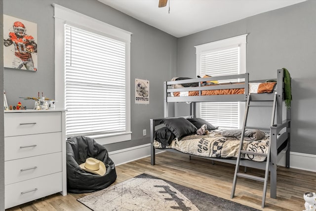 bedroom with light wood-type flooring and ceiling fan