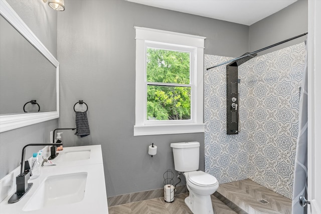 bathroom featuring toilet, parquet floors, curtained shower, and vanity