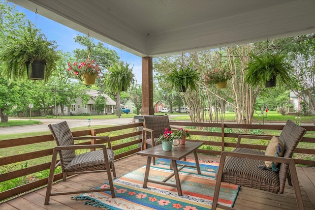 wooden terrace with a yard