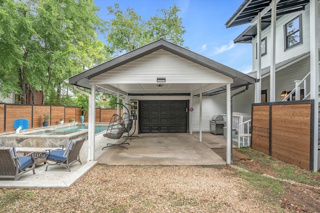 garage featuring a fenced in pool