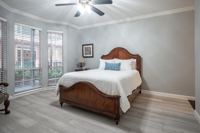 bedroom featuring light hardwood / wood-style floors, crown molding, and ceiling fan