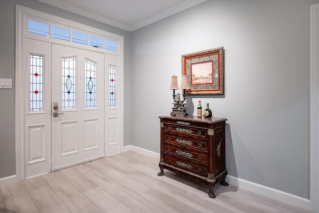 entrance foyer featuring light hardwood / wood-style floors and crown molding