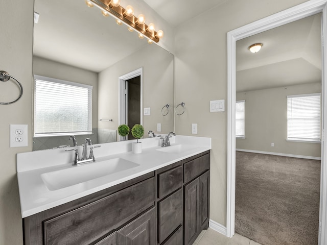 bathroom with vanity and a wealth of natural light