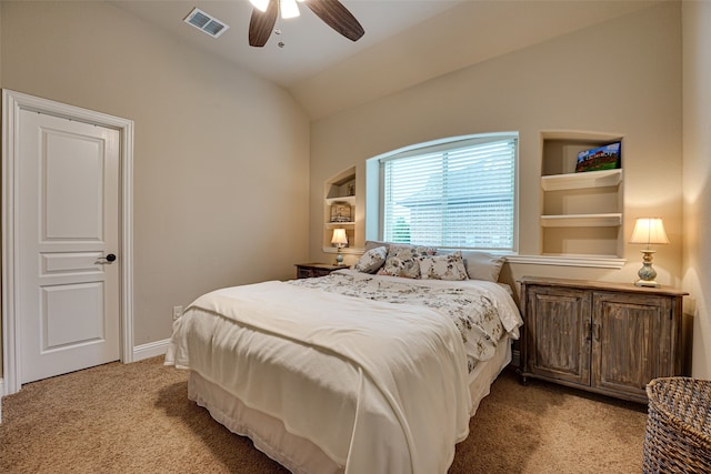 bedroom with ceiling fan, light carpet, and vaulted ceiling