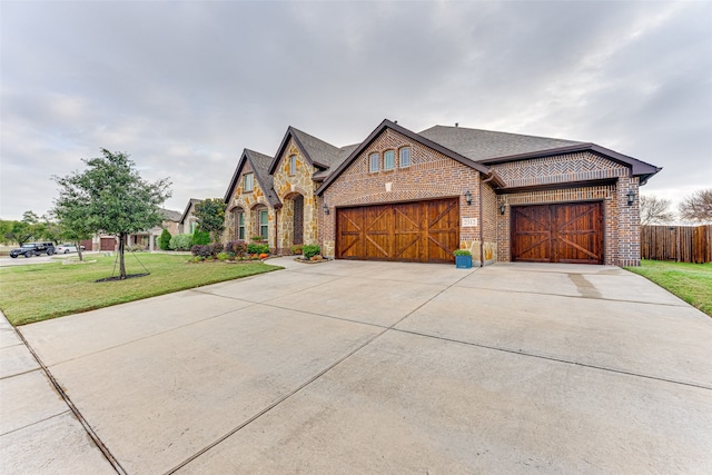 view of front facade featuring a front lawn and a garage