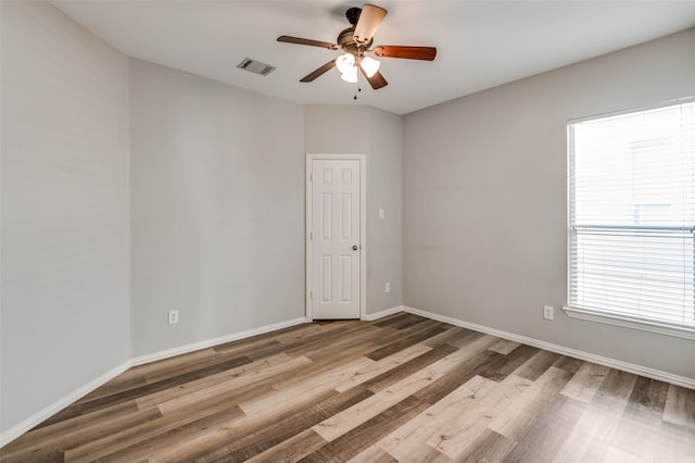 unfurnished room with light hardwood / wood-style flooring and ceiling fan