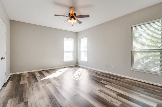 unfurnished room with hardwood / wood-style floors and ceiling fan