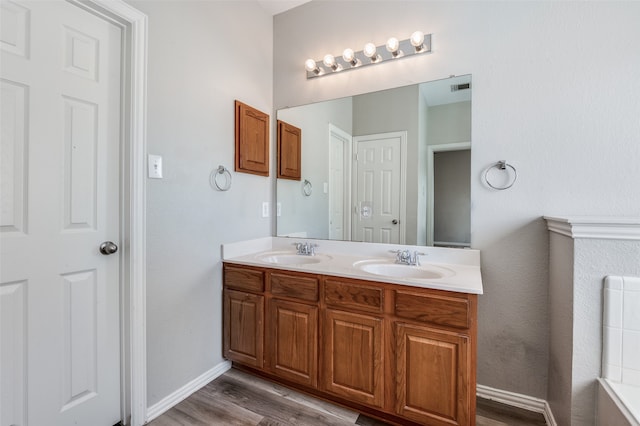 bathroom featuring vanity and hardwood / wood-style flooring