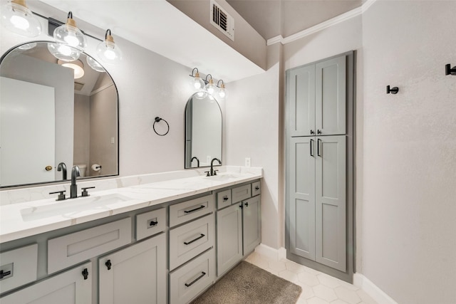 bathroom with tile patterned floors and vanity