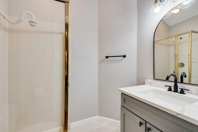 bathroom featuring tile patterned flooring, vanity, and a shower with door