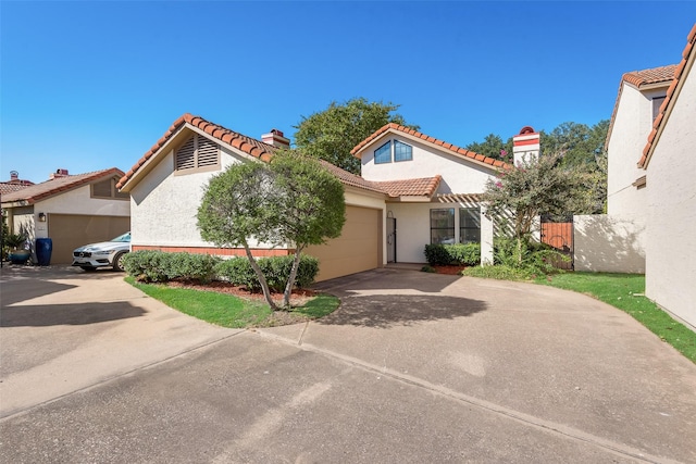 mediterranean / spanish house featuring a garage