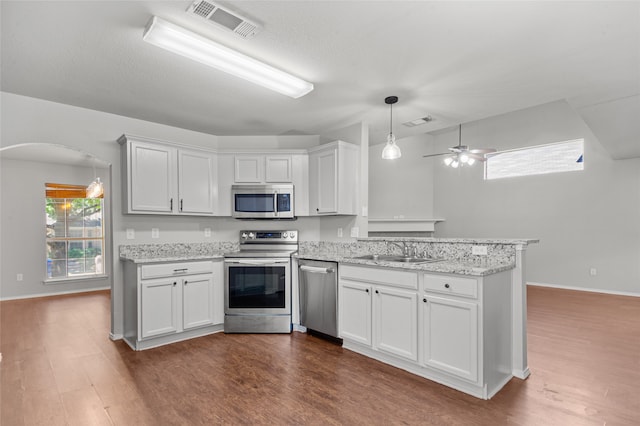 kitchen with white cabinetry, ceiling fan, stainless steel appliances, and sink