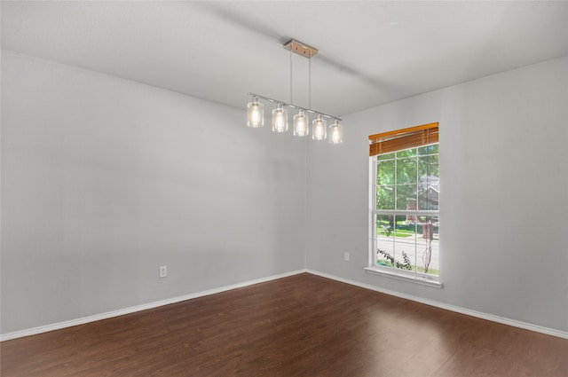 empty room featuring dark hardwood / wood-style flooring