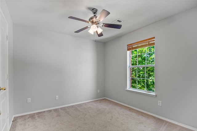 carpeted empty room with ceiling fan