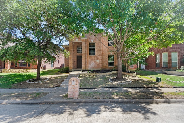 view of front of property with a front lawn