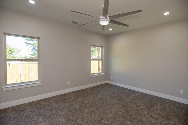 carpeted empty room featuring ceiling fan