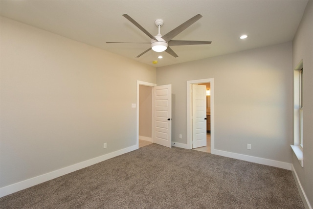 unfurnished bedroom featuring carpet floors and ceiling fan