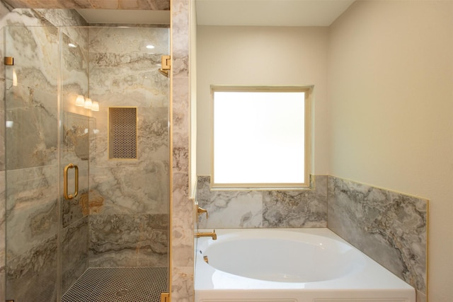 bathroom with shower with separate bathtub