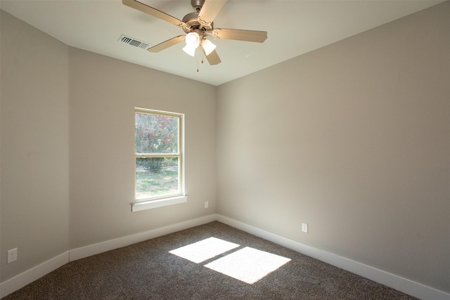 carpeted empty room featuring ceiling fan