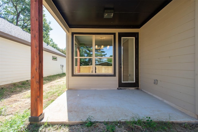 property entrance featuring a patio