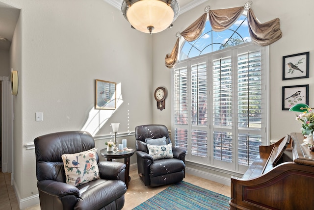 sitting room featuring crown molding and light tile patterned flooring