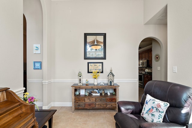 living area with light tile patterned floors