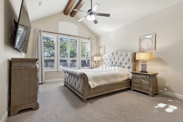 carpeted bedroom with lofted ceiling with beams and ceiling fan