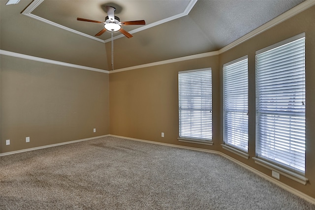 spare room with lofted ceiling, ornamental molding, carpet, and ceiling fan