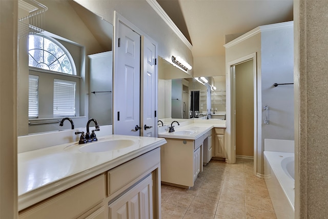 bathroom featuring a bathing tub, tile patterned flooring, vanity, and vaulted ceiling