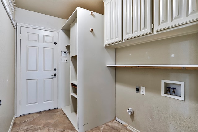 washroom featuring electric dryer hookup, washer hookup, and cabinets