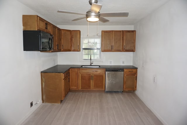 kitchen with stainless steel dishwasher, sink, light wood-type flooring, and ceiling fan