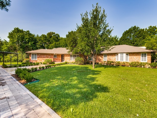 ranch-style house with a front yard