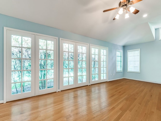 interior space featuring ceiling fan and lofted ceiling