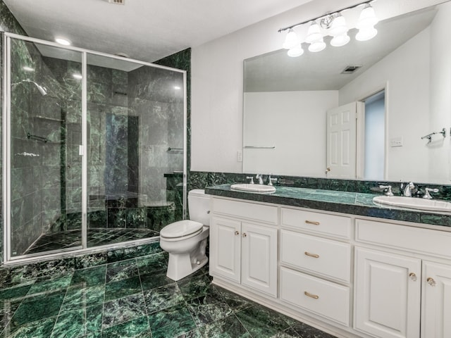 bathroom with vanity, toilet, and walk in shower