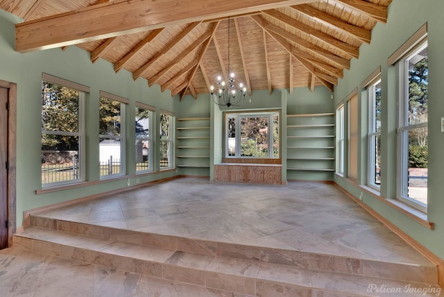 unfurnished sunroom featuring a healthy amount of sunlight, vaulted ceiling with beams, a notable chandelier, and wood ceiling