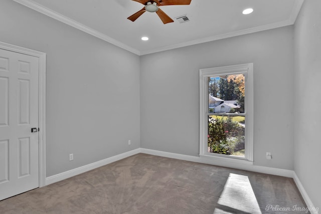 carpeted empty room featuring crown molding and ceiling fan