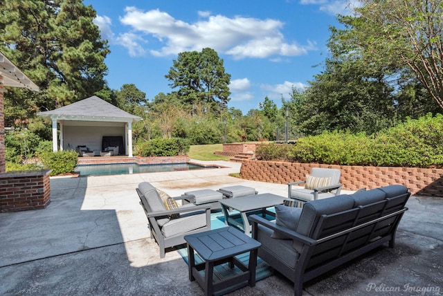 view of patio featuring an outbuilding and outdoor lounge area