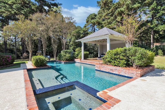 view of swimming pool featuring a gazebo, a patio area, and an in ground hot tub