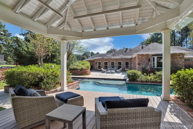 view of swimming pool featuring a gazebo and a deck